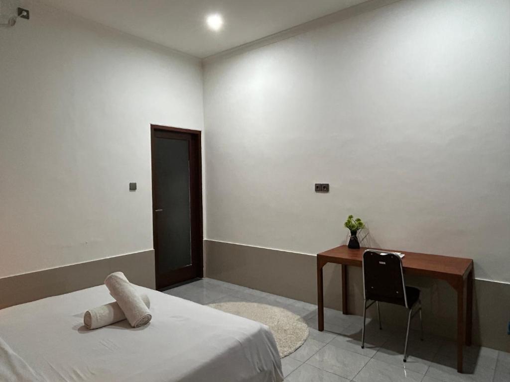 Postel nebo postele na pokoji v ubytování Sayang Bungalows