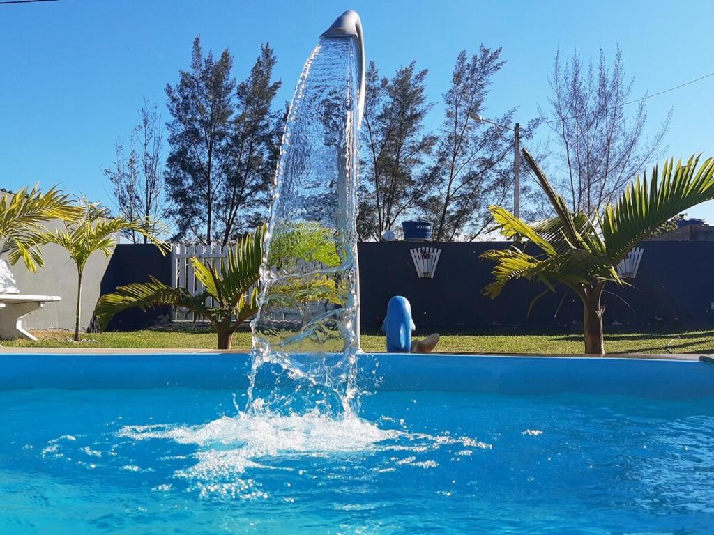 Πισίνα στο ή κοντά στο Casa de Praia com Piscina