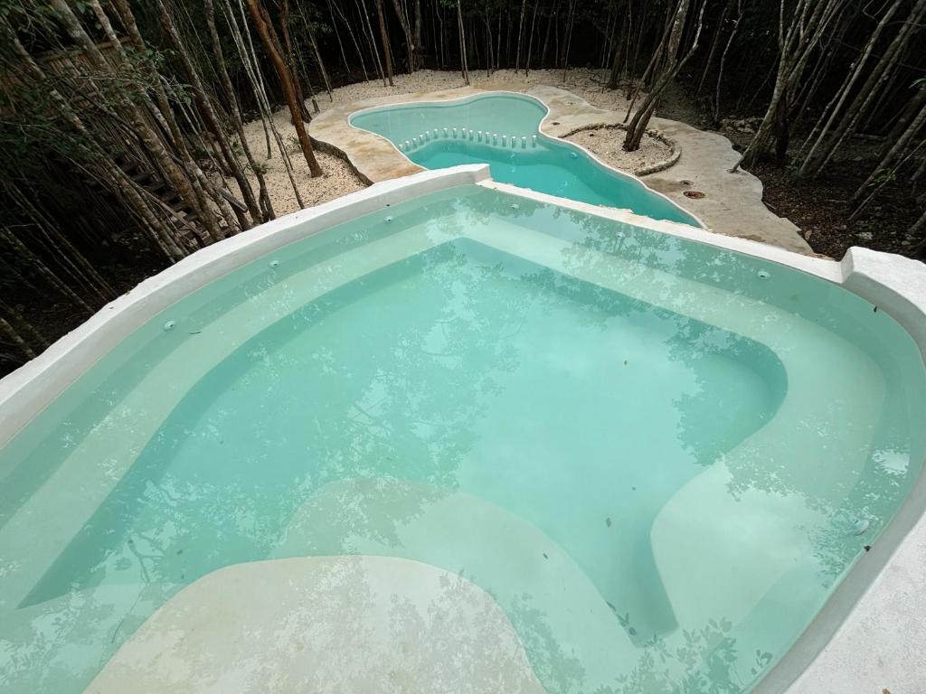 Bazén v ubytování Aldea Maya-Ha Cabañas con cenotes nebo v jeho okolí