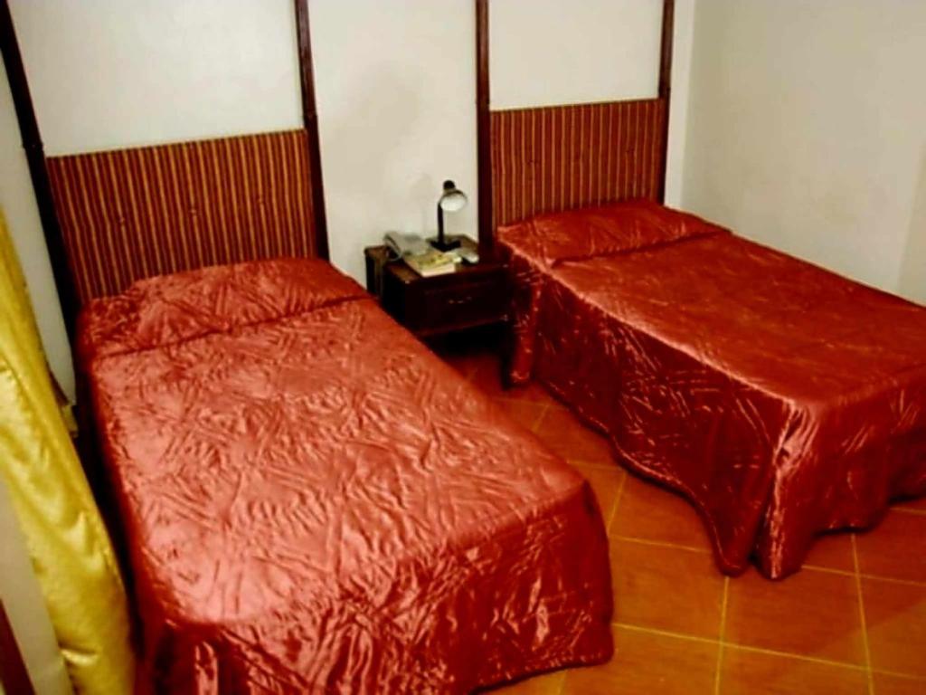 Postel nebo postele na pokoji v ubytování DDD Habitat, Inc - Cagayan De Oro