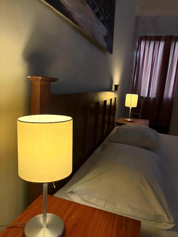 Postel nebo postele na pokoji v ubytování Hotel Janaki