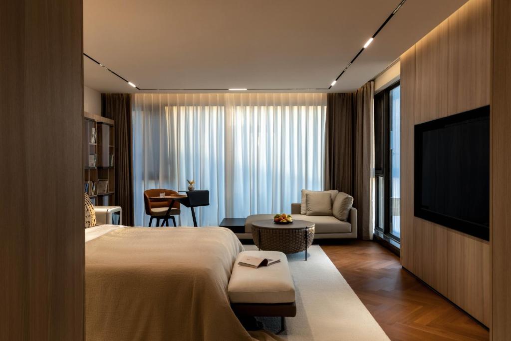 TV a/nebo společenská místnost v ubytování Taohuawu Mountain Luxury Villa Hotel