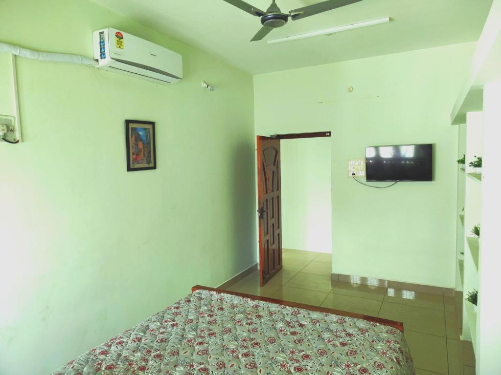 Postel nebo postele na pokoji v ubytování Shivam Eden Beach Homestay