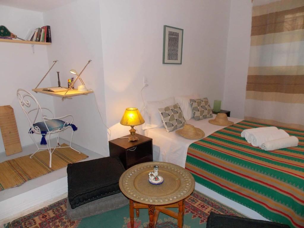 Postel nebo postele na pokoji v ubytování Riad mazighen