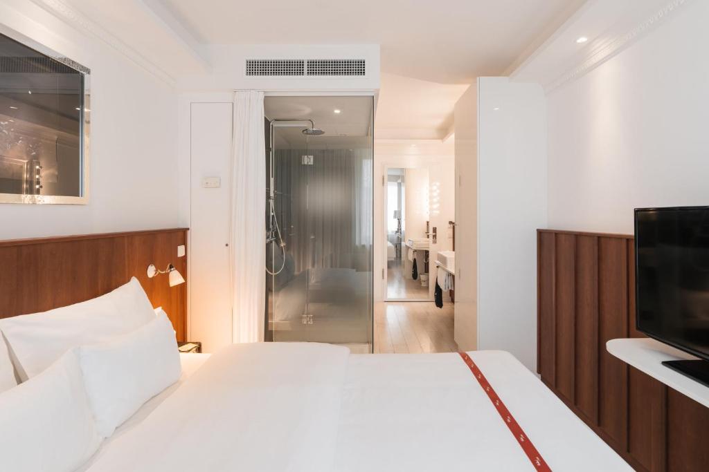 Postel nebo postele na pokoji v ubytování Ruby Sofie Hotel Vienna