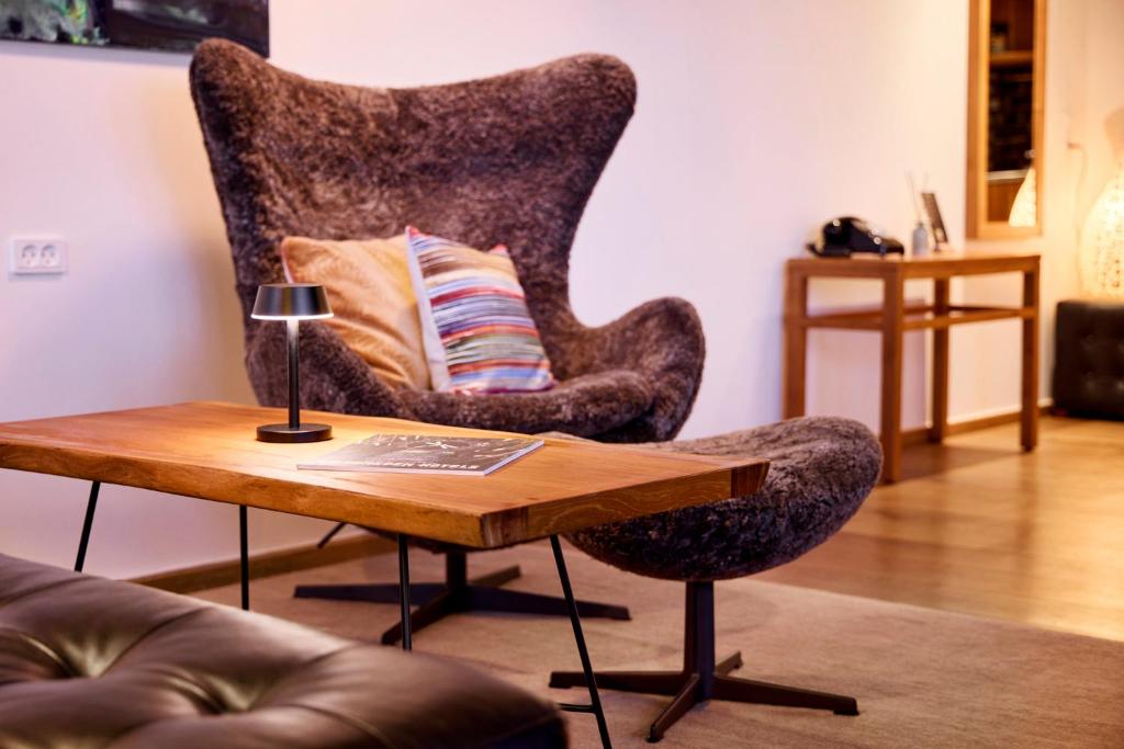 Posezení v ubytování Manon Les Suites Guldsmeden