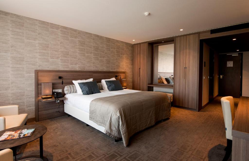 Postel nebo postele na pokoji v ubytování Van der Valk Hotel Hengelo