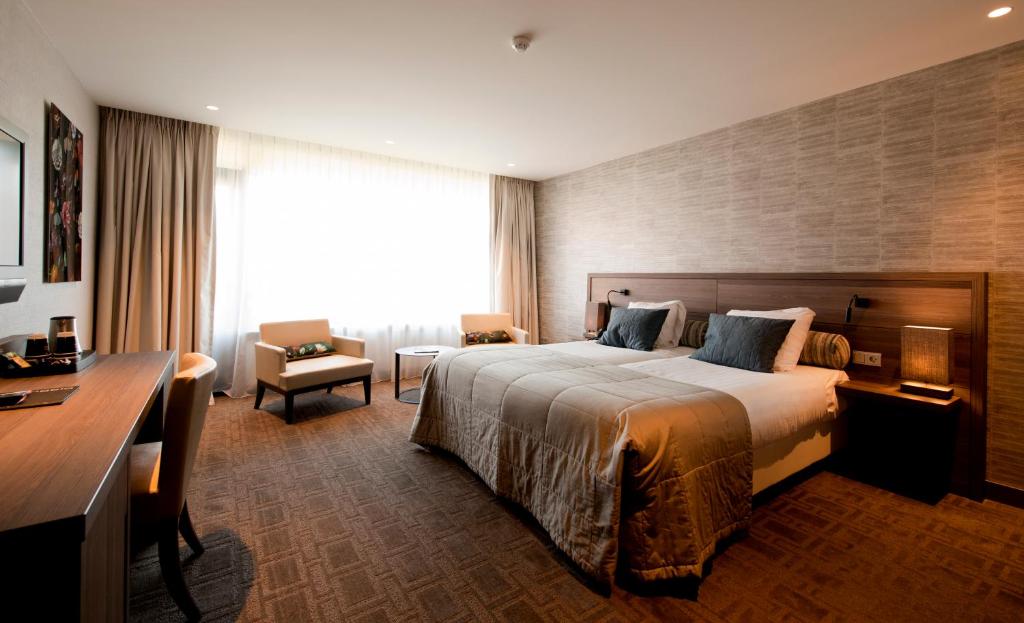 Postel nebo postele na pokoji v ubytování Van der Valk Hotel Hengelo