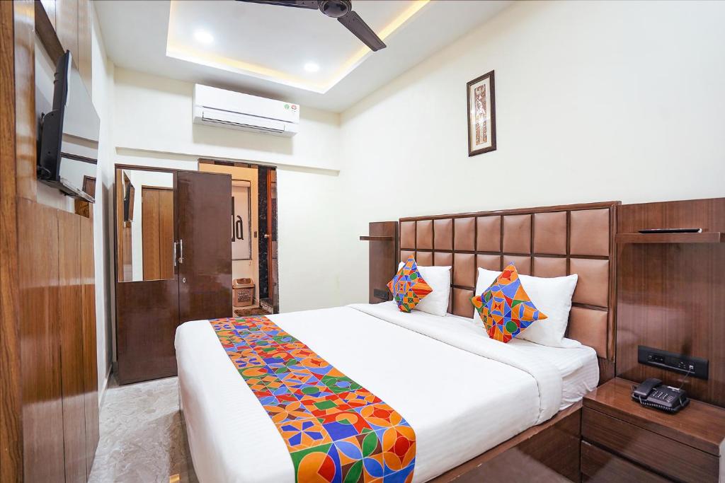Postel nebo postele na pokoji v ubytování FabHotel Sarja Sky