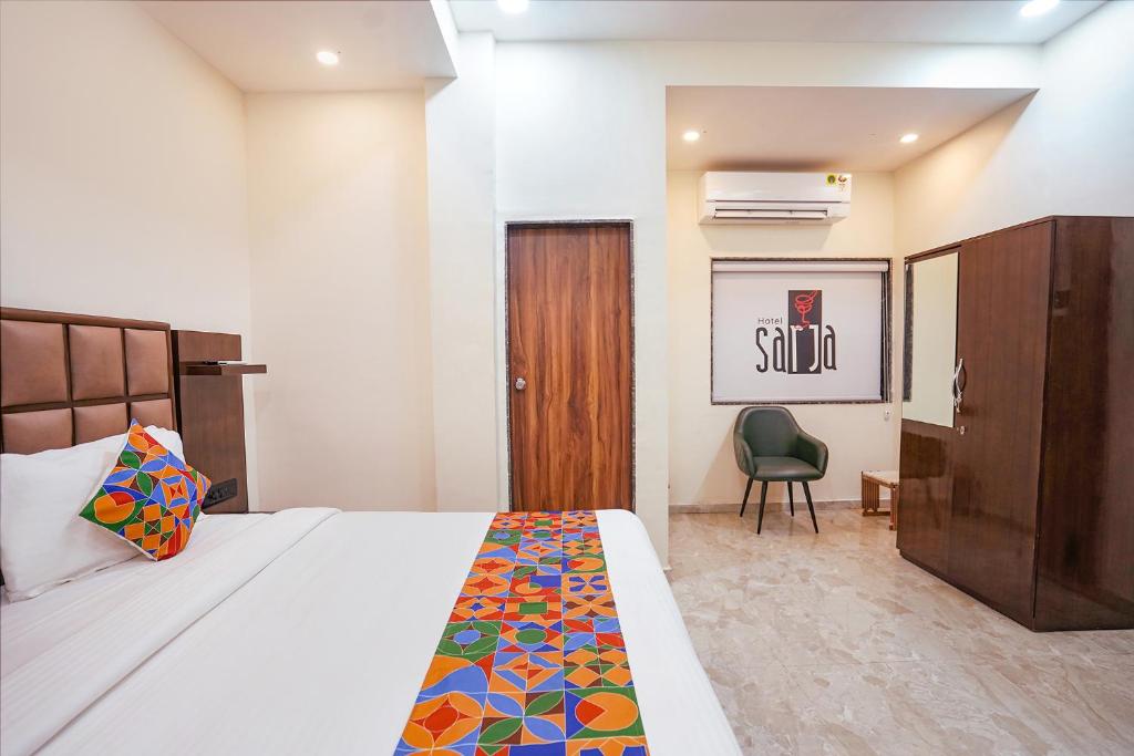 Postel nebo postele na pokoji v ubytování FabHotel Sarja Sky