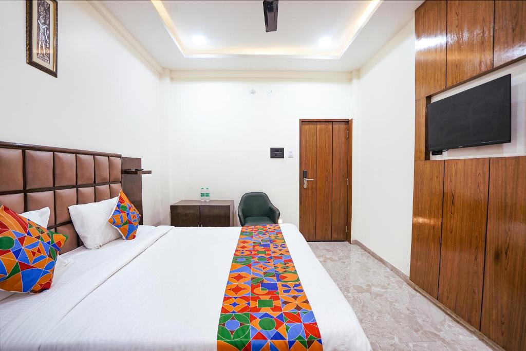 Postel nebo postele na pokoji v ubytování FabHotel Sarja Sky