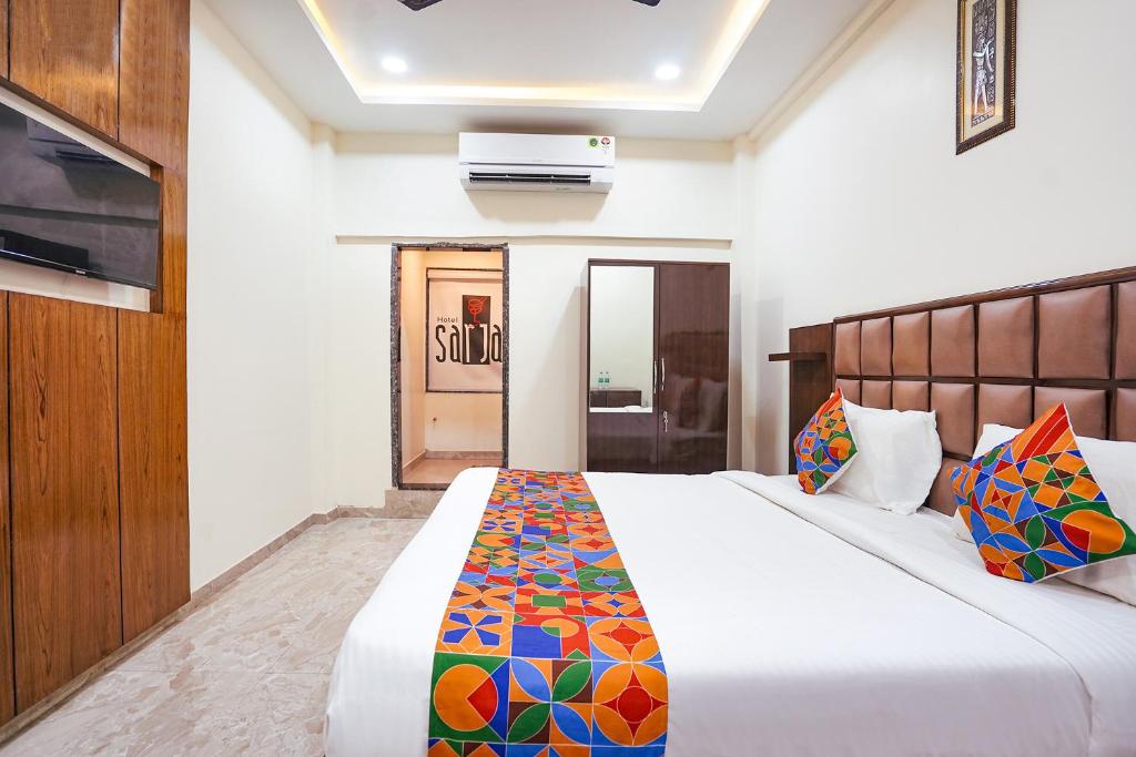 Postel nebo postele na pokoji v ubytování FabHotel Sarja Sky