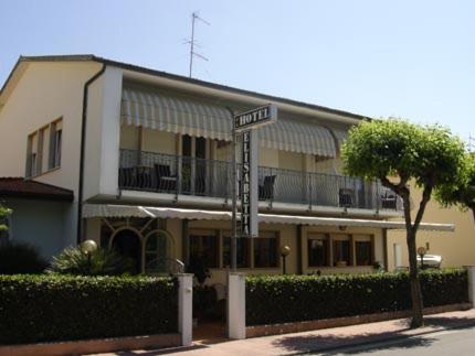 a building with a street sign in front of it at Hotel Elisabetta in Cinquale