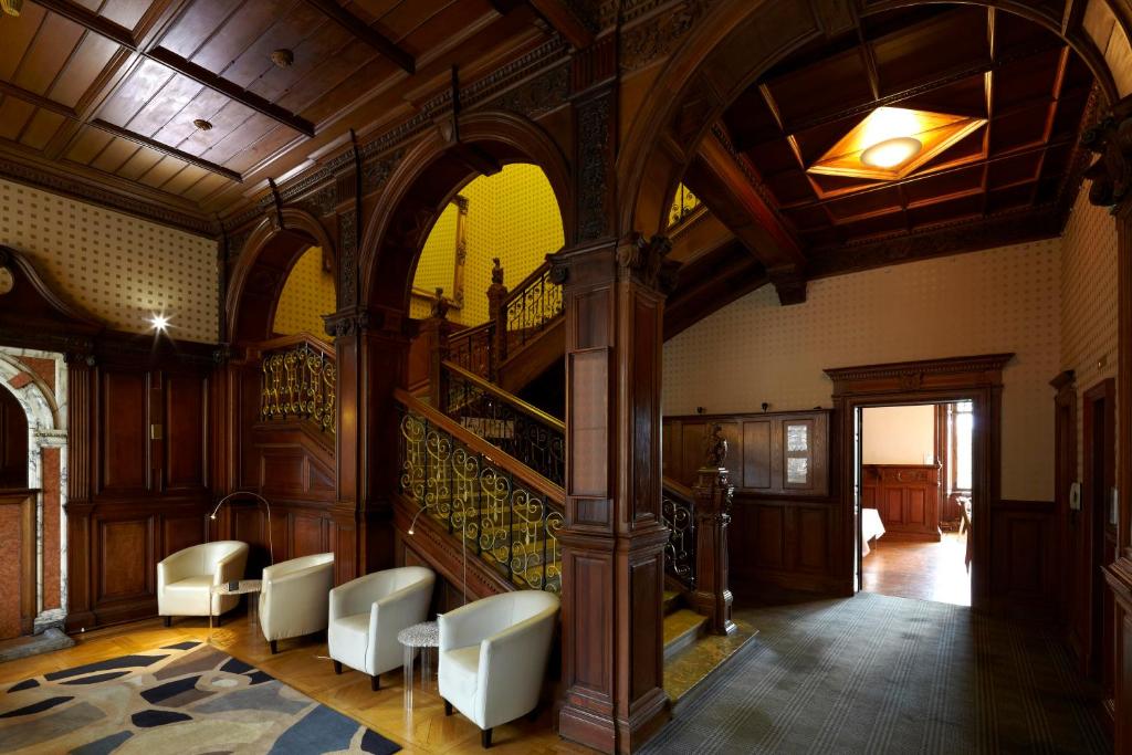 a large room with a staircase in a building at B+B Edinburgh in Edinburgh