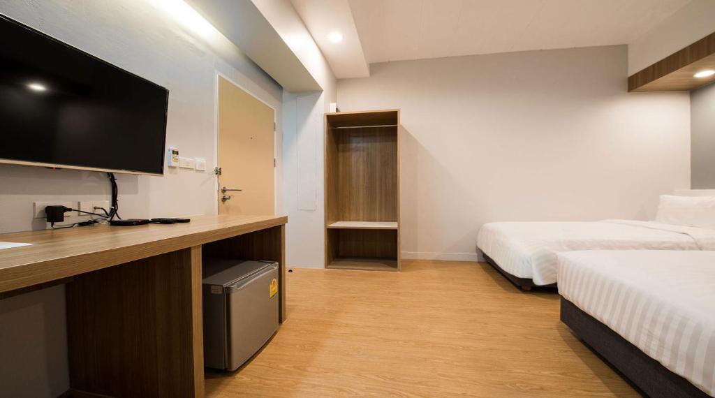Postel nebo postele na pokoji v ubytování Shade House - Bitec Bangna