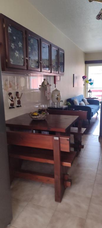 a living room with a table and a couch at casa na Torre in Machico