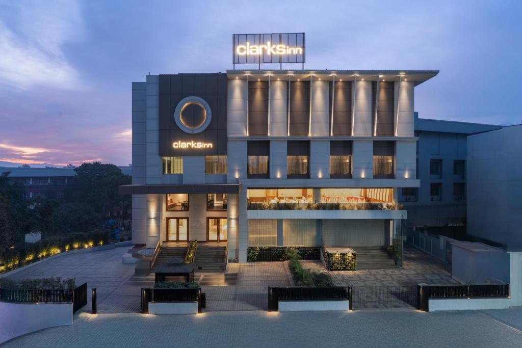 a building with a sign on top of it at Clarks Inn Dehradun in Dehradun