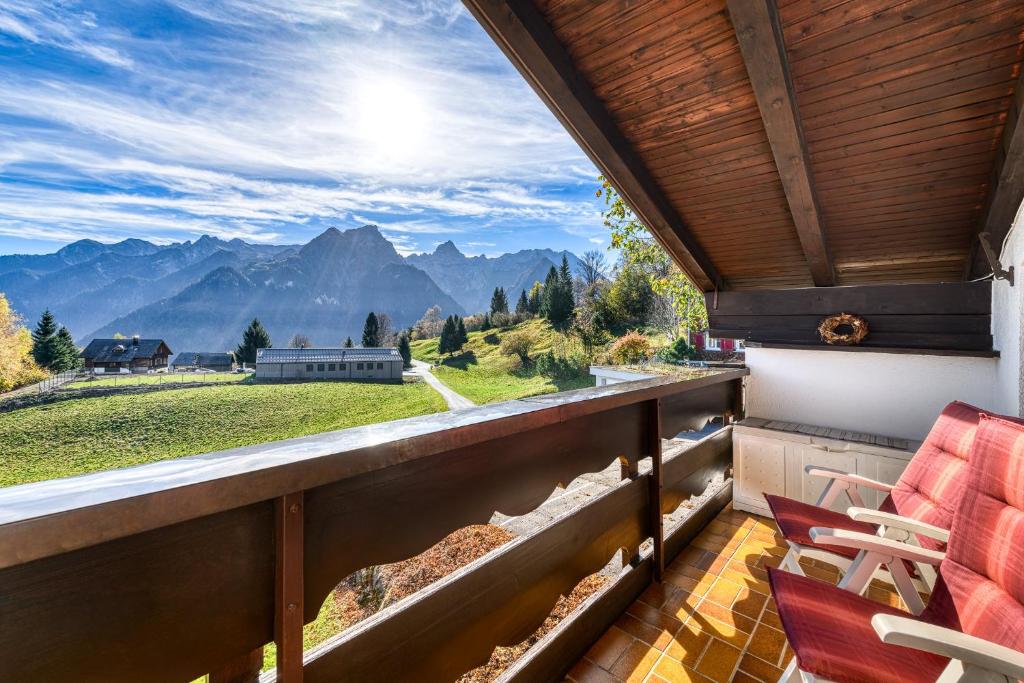 a balcony with a view of the mountains at Bergjuwel Tschengla in Bürserberg