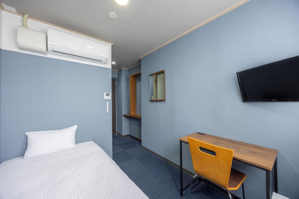 TV a/nebo společenská místnost v ubytování Fukuyama Royal Hotel