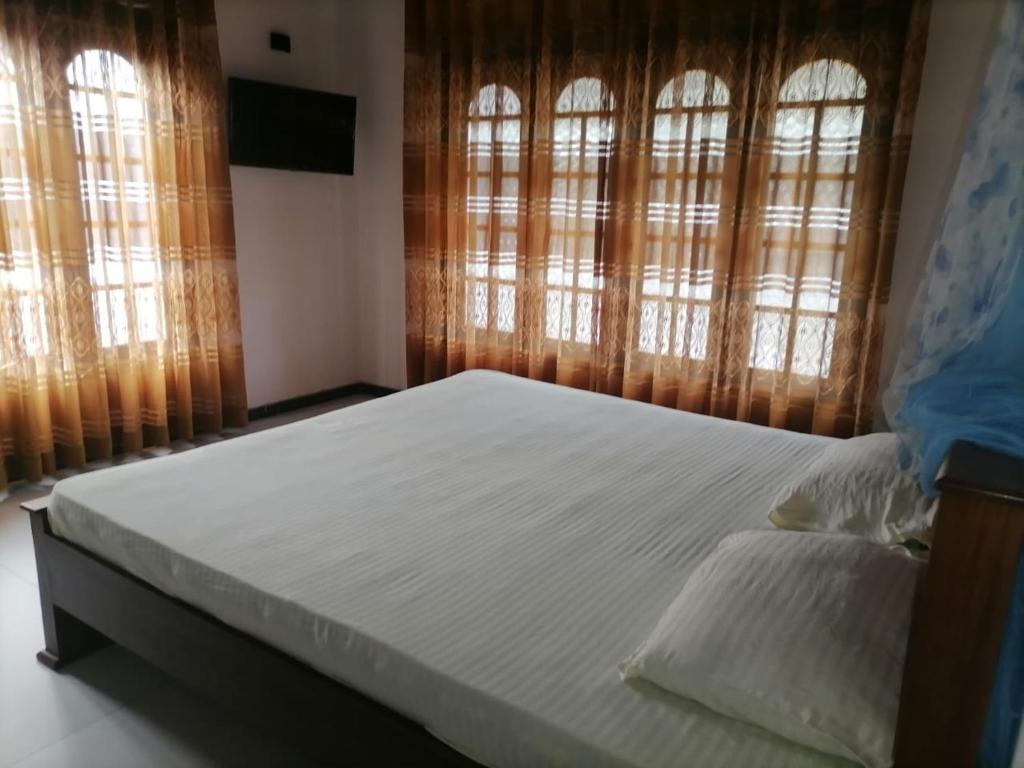 Ένα ή περισσότερα κρεβάτια σε δωμάτιο στο Bliss House