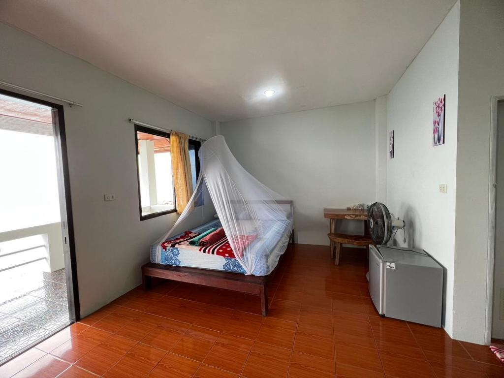 Postel nebo postele na pokoji v ubytování Char Bungalows
