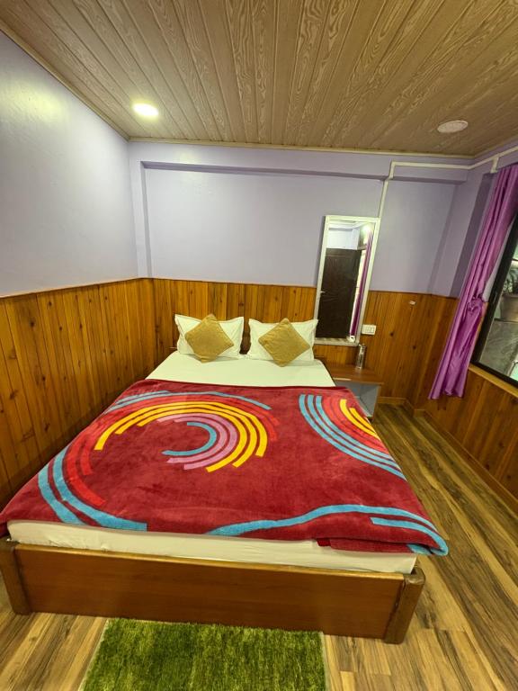 Postel nebo postele na pokoji v ubytování S Sherpa Homestay