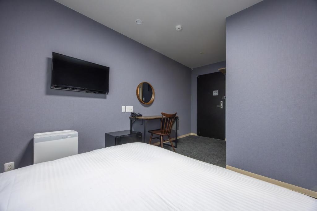 TV a/nebo společenská místnost v ubytování Fukuyama Royal Hotel