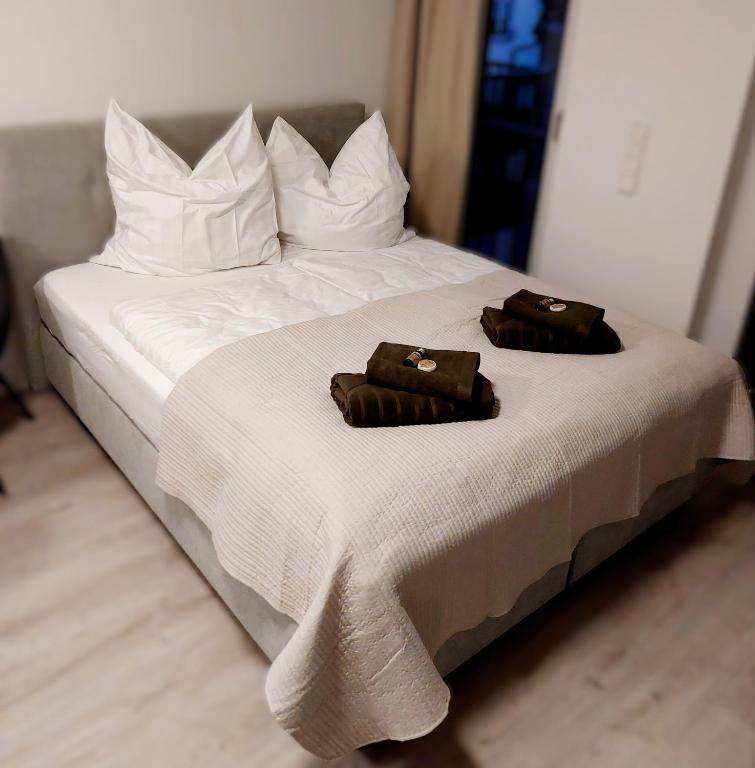 Postel nebo postele na pokoji v ubytování Apartment Metzingen Outlet City Business Zentral Modern