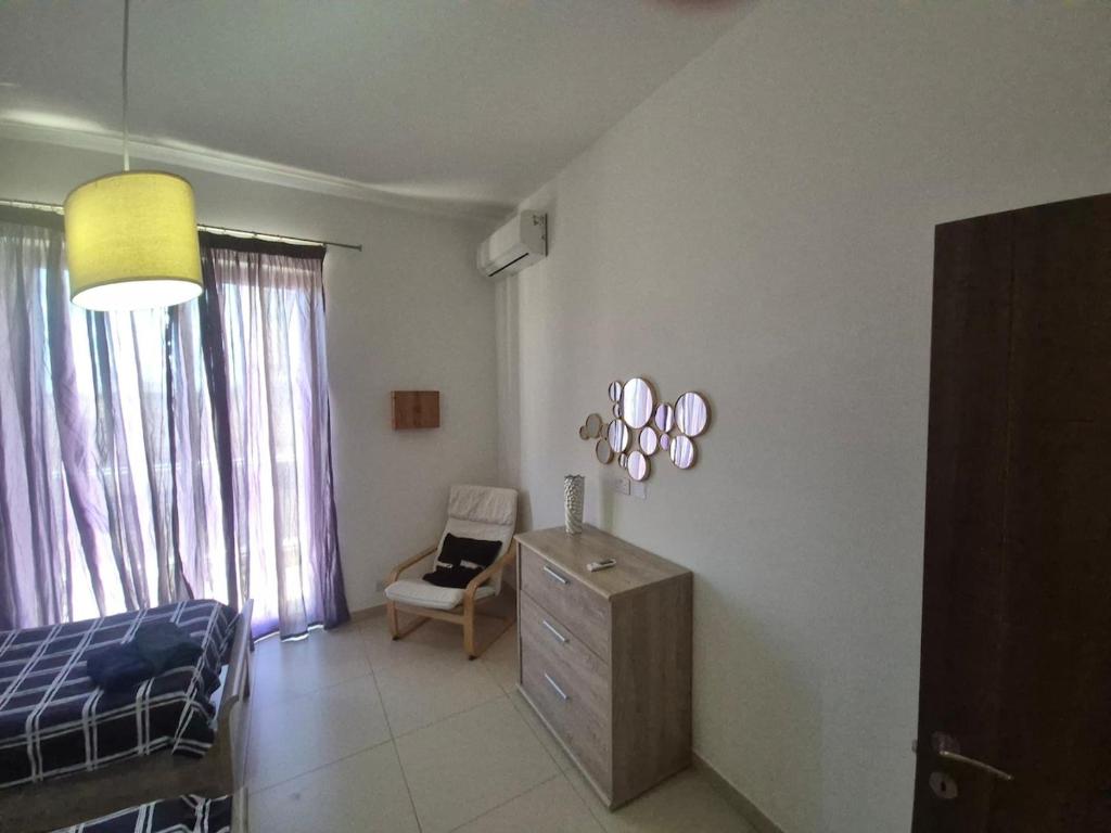 Postel nebo postele na pokoji v ubytování ICC Holiday apartment in Marsascala