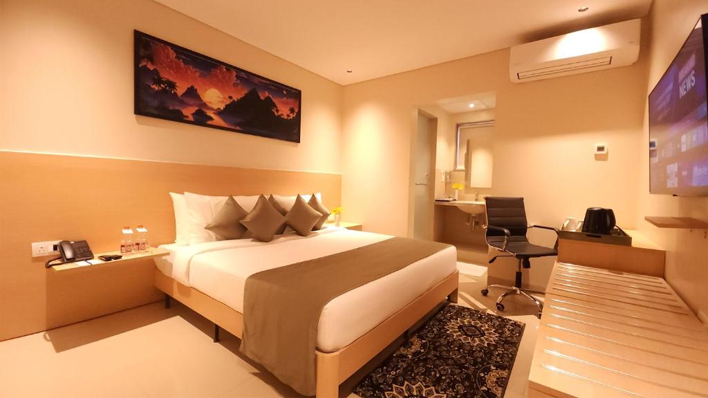 Postel nebo postele na pokoji v ubytování Morvee Hotels Durgapur