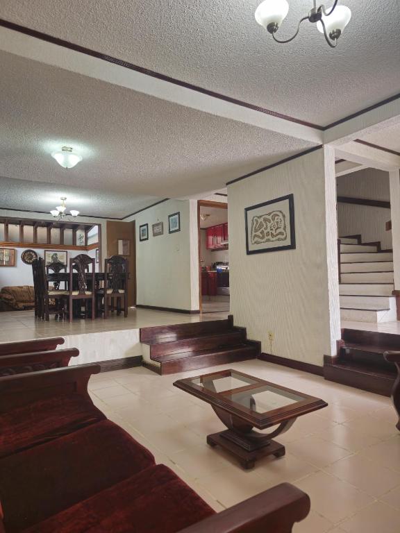 a room with chairs and a table in a room at Casa en zona residencial in Oaxaca City
