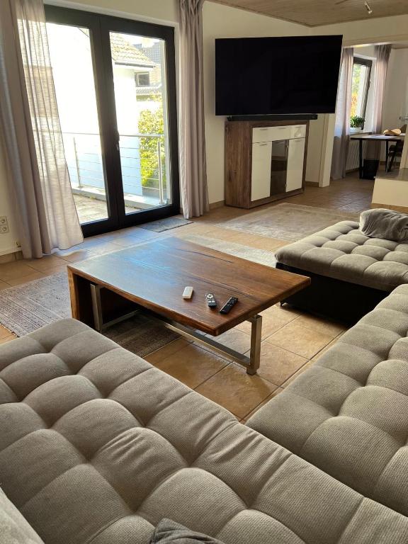 a living room with a couch and a coffee table at WohlfühlQuartier Schwedenstein in Bad Oeynhausen