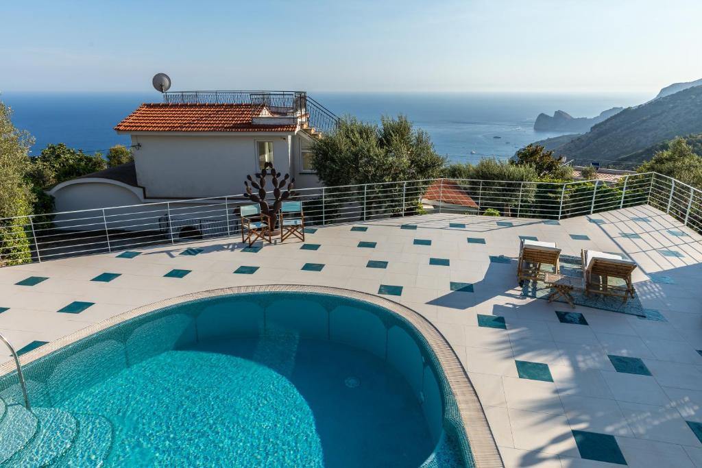 a swimming pool with a view of the ocean at Villa MyHeart in Massa Lubrense