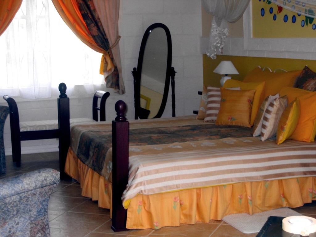 a bedroom with a large bed with a large mirror at The Legend Garden Condos in Saint Peter