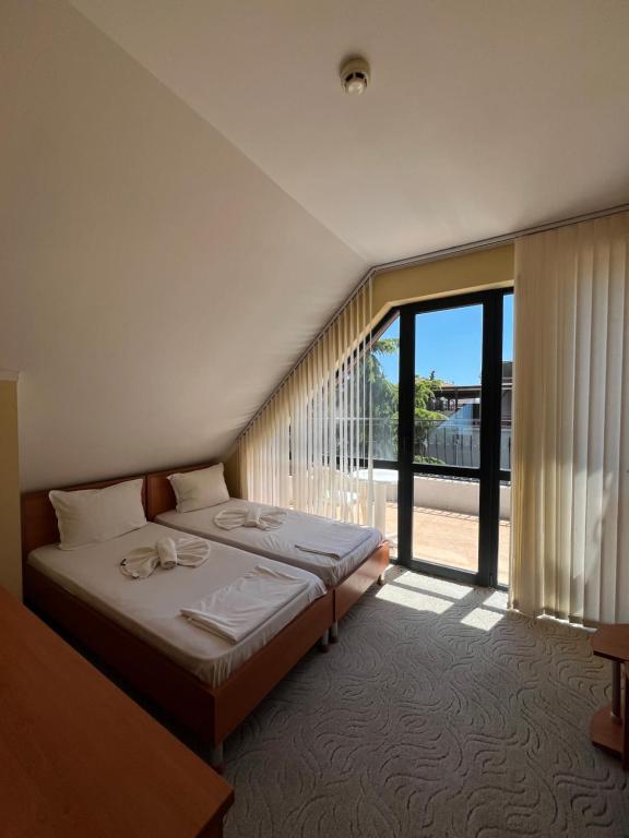 Postel nebo postele na pokoji v ubytování Adeti Residence