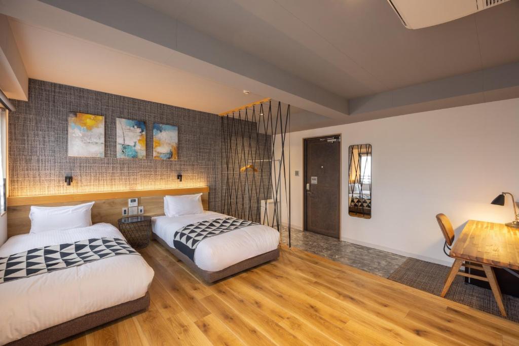 Postel nebo postele na pokoji v ubytování Fukuyama Royal Hotel