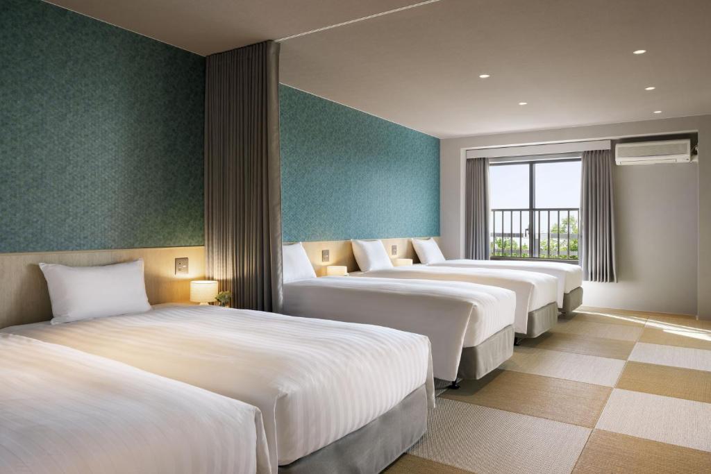 Postel nebo postele na pokoji v ubytování Hotel Laforet Nasu