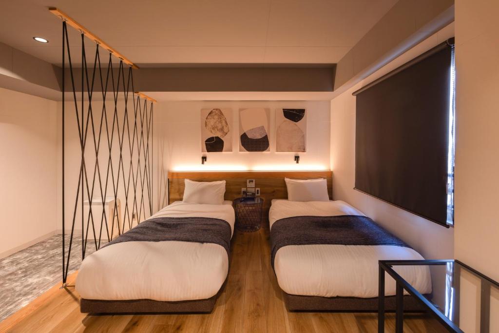 Postel nebo postele na pokoji v ubytování Fukuyama Royal Hotel