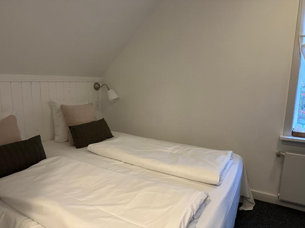 Cama o camas de una habitación en Tune Kursuscenter