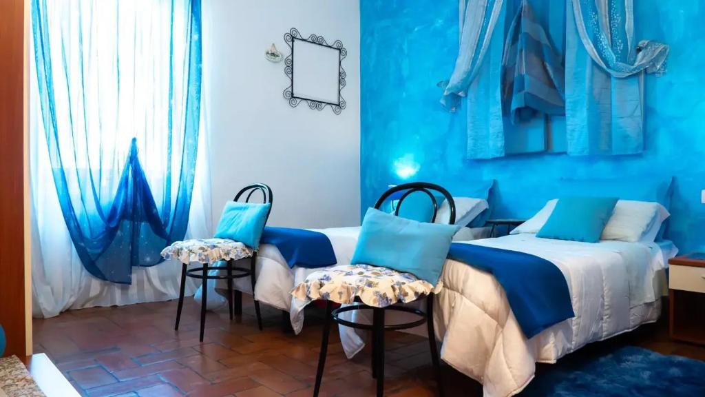 Posteľ alebo postele v izbe v ubytovaní B&B Aesis La Dolce Collina