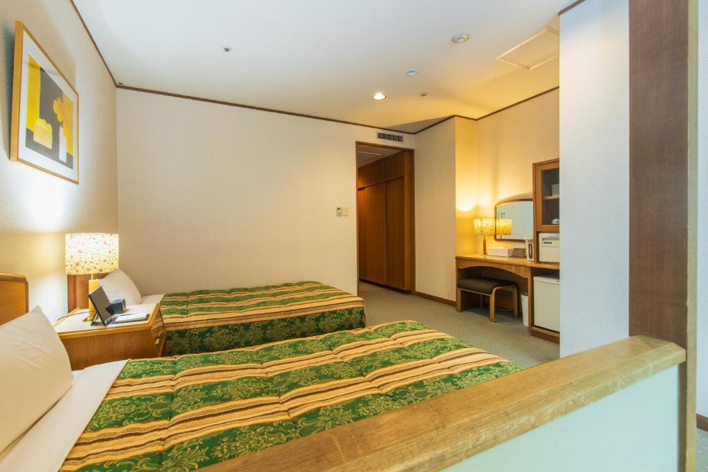 Postel nebo postele na pokoji v ubytování Hotel Laforet Nasu