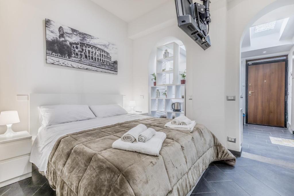 Giường trong phòng chung tại Battistini Sweet House