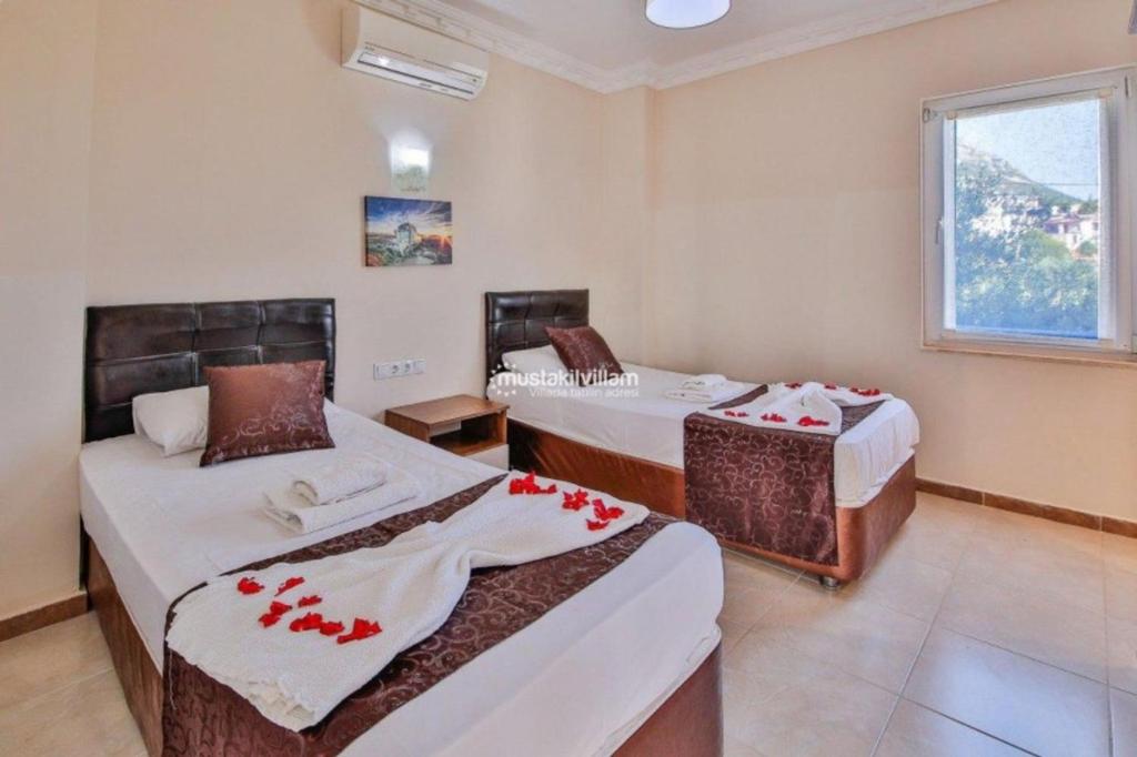 Postel nebo postele na pokoji v ubytování Villa Kubra Akbel Kas Antalya Turkey