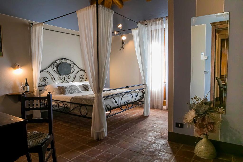 Postel nebo postele na pokoji v ubytování Agriturismo La Torricella