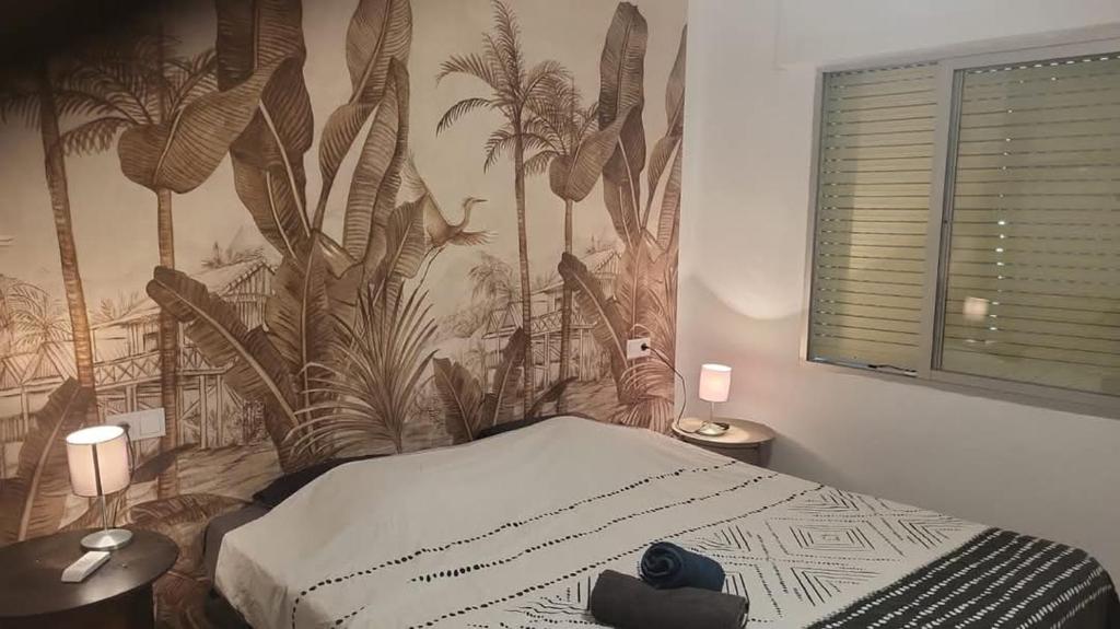 Łóżko lub łóżka w pokoju w obiekcie Appartement à 250m de la plage