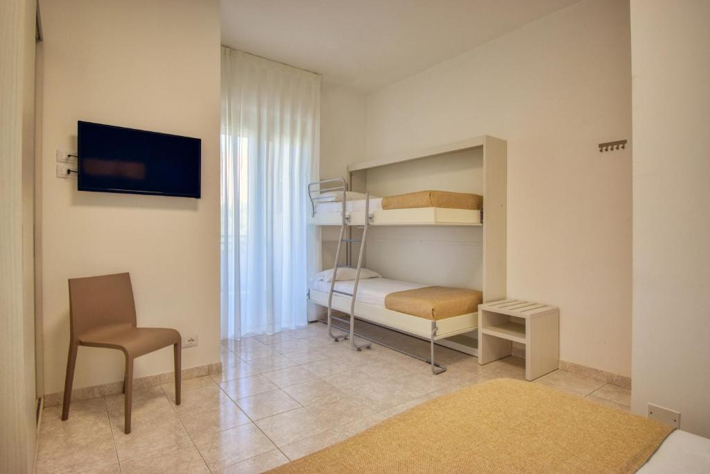 Postel nebo postele na pokoji v ubytování Ambra Hotel Cattolica