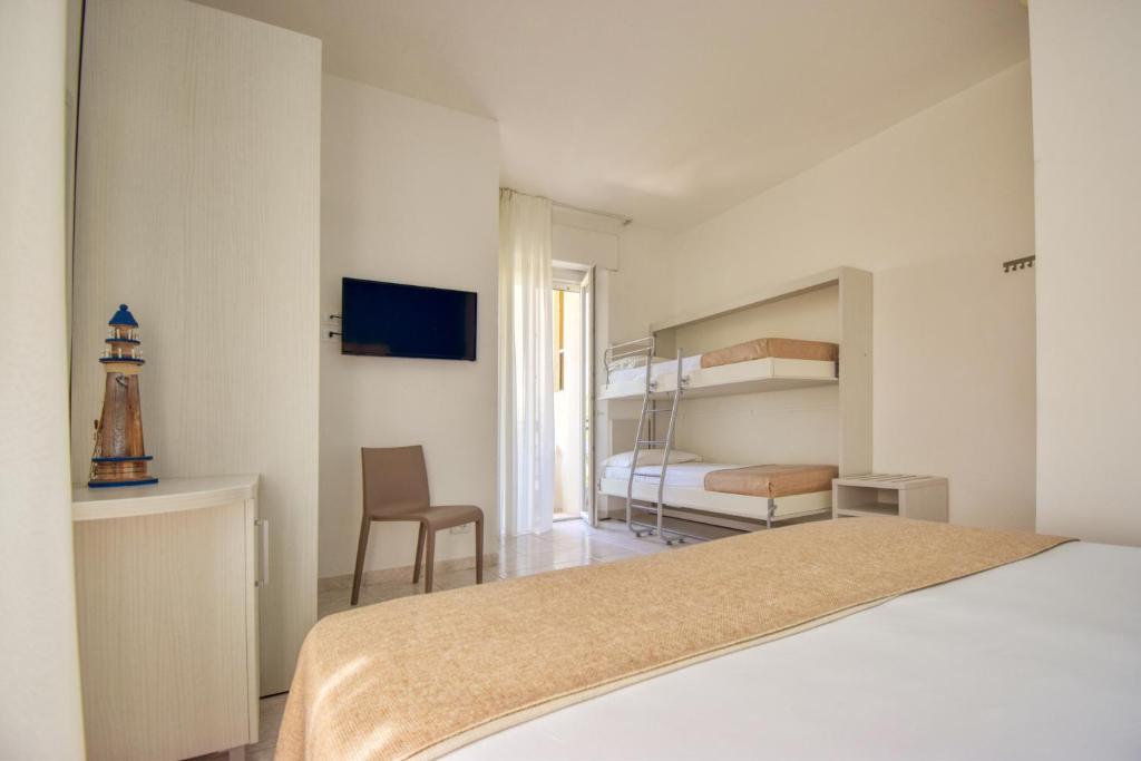 Postel nebo postele na pokoji v ubytování Ambra Hotel Cattolica