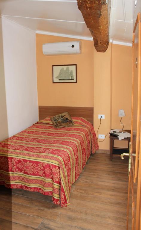 Postel nebo postele na pokoji v ubytování Hotel San Lorenzo