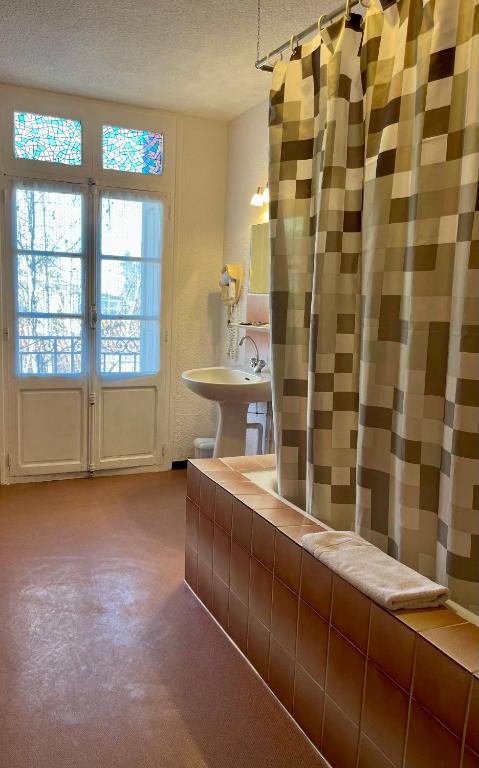 Koupelna v ubytování Hotel Alexander