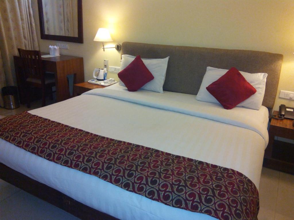 Postel nebo postele na pokoji v ubytování Park Residency Luxury Business Hotel